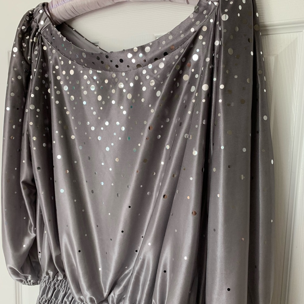 Glam is up with this gray and silver ombré top